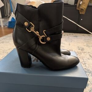 Isola Black Heeled Boots with Gold Accents